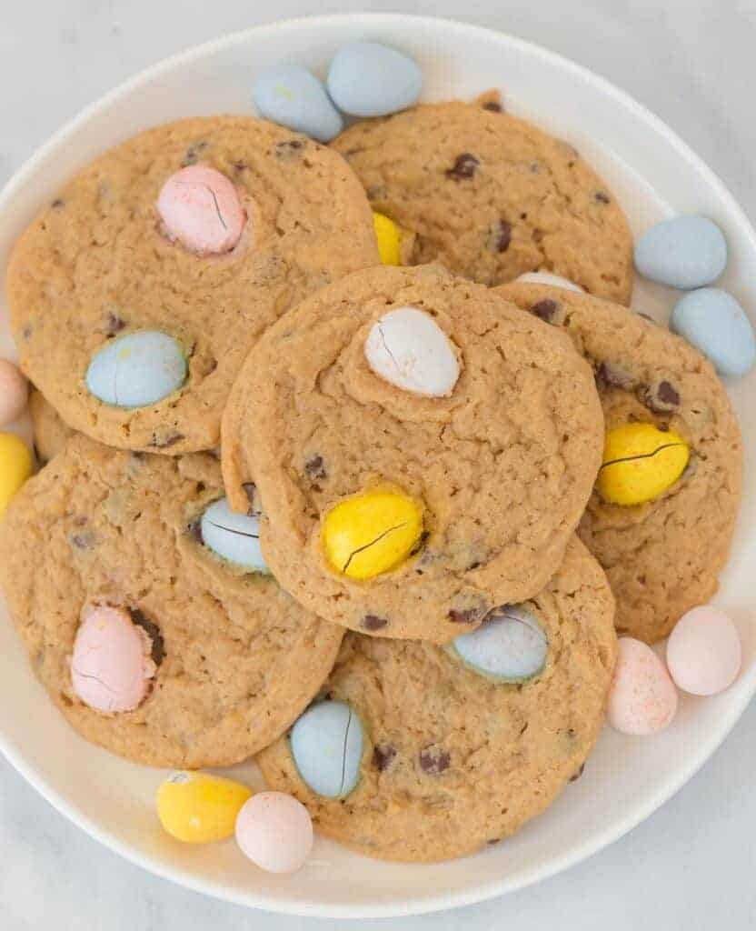cadbury cookies on a white plate surrounded by mini cadbury eggs