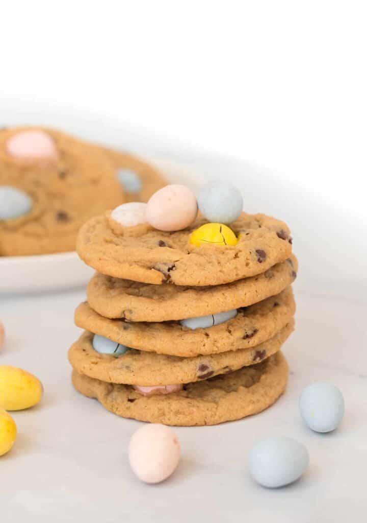 5 cadbury mini egg cookies stacked on top of each other