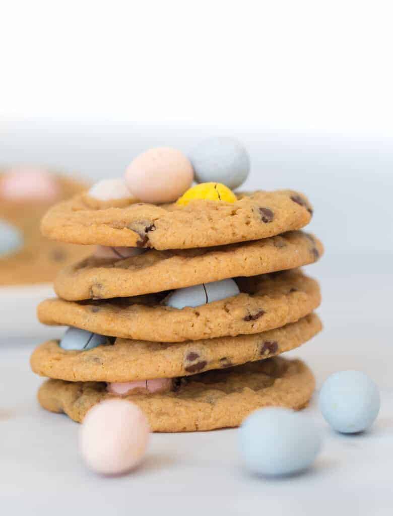 5 cadbury mini egg cookies stacked on top of each other