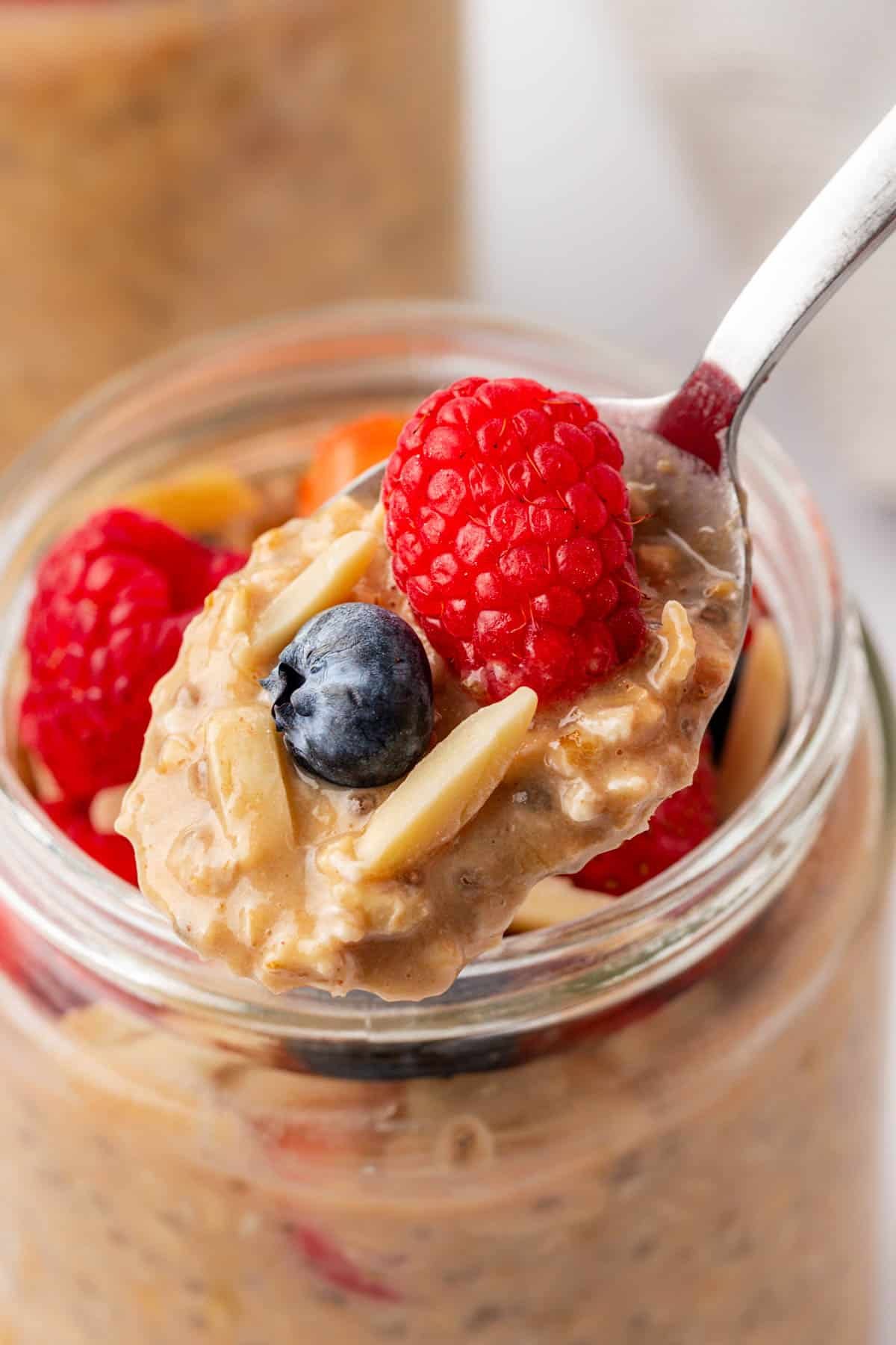 protein overnight oats topped with berries and almonds