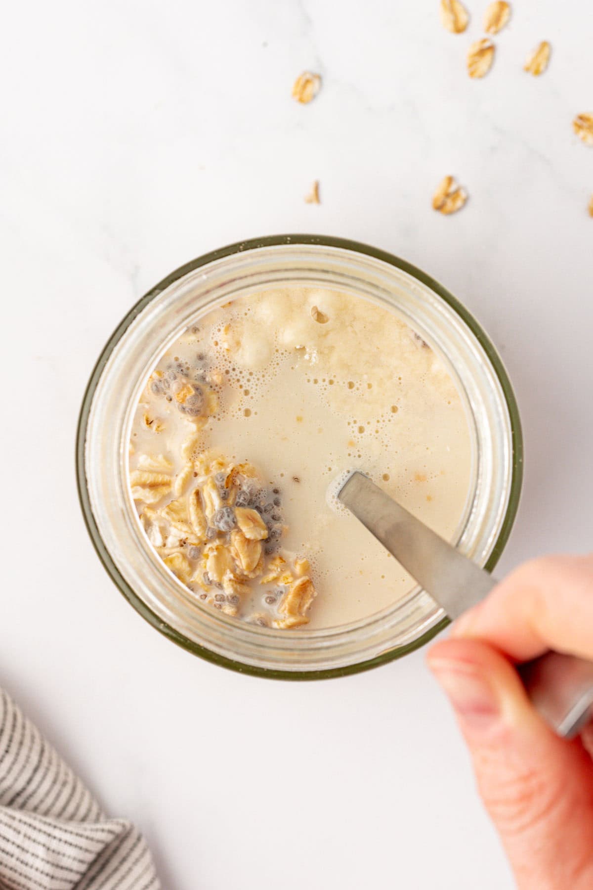 stirring the overnight oats ingredients together