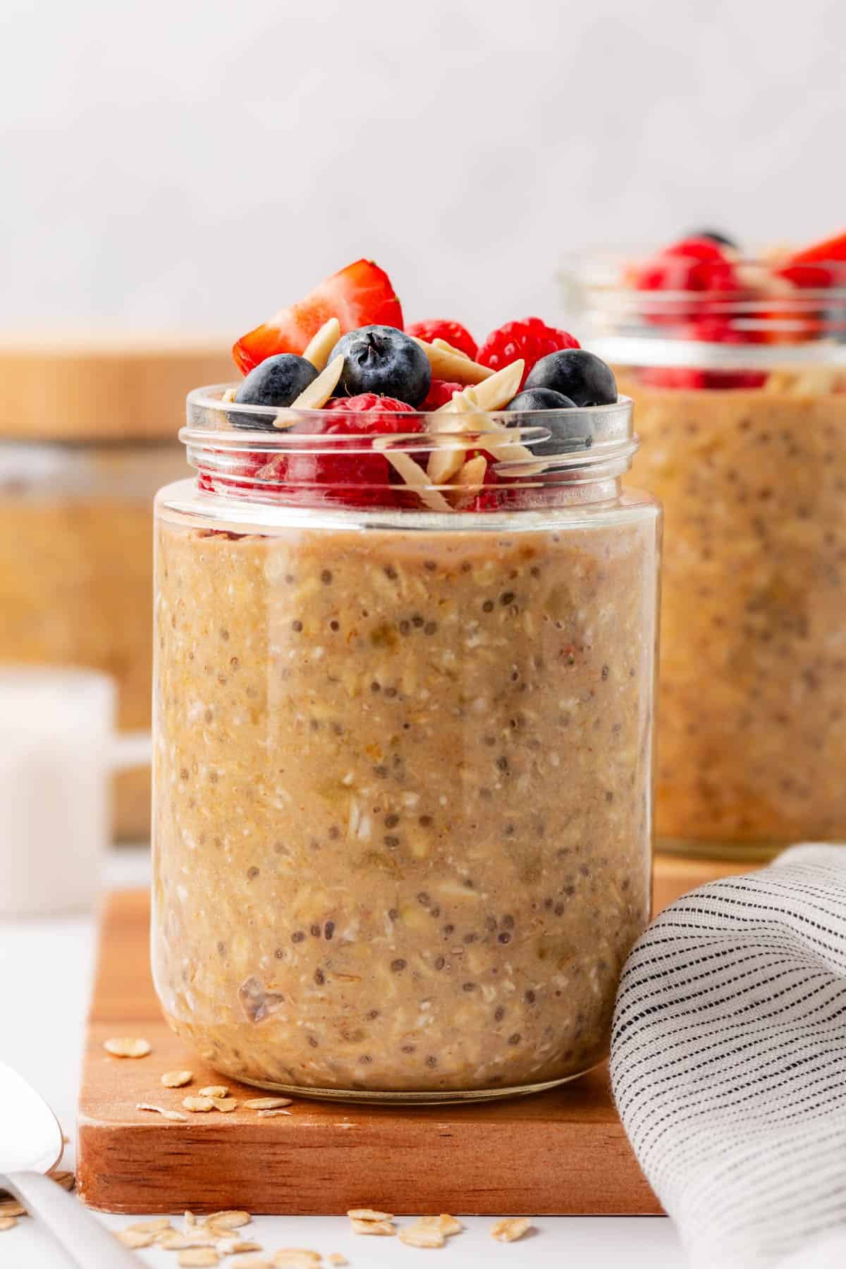 protein overnight oats topped with berries and almonds
