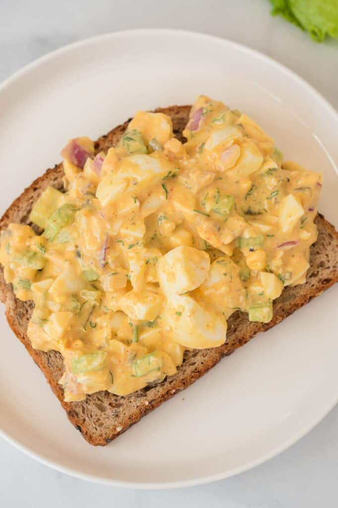 egg salad open faced on a slice of bread