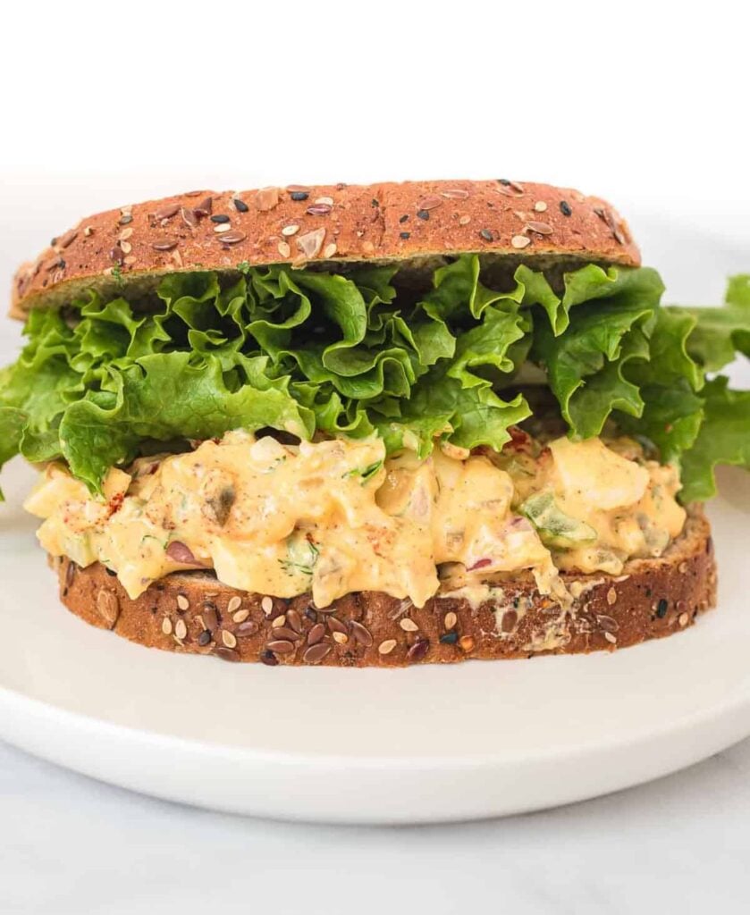 healthy egg salad sandwich with lettuce on top