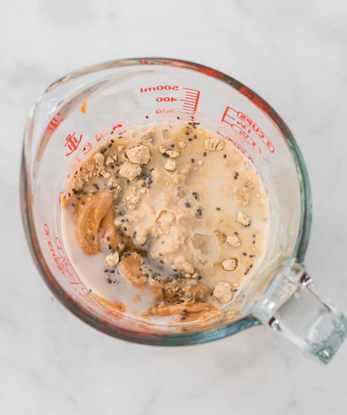 overnight oats in a glass measuring cup