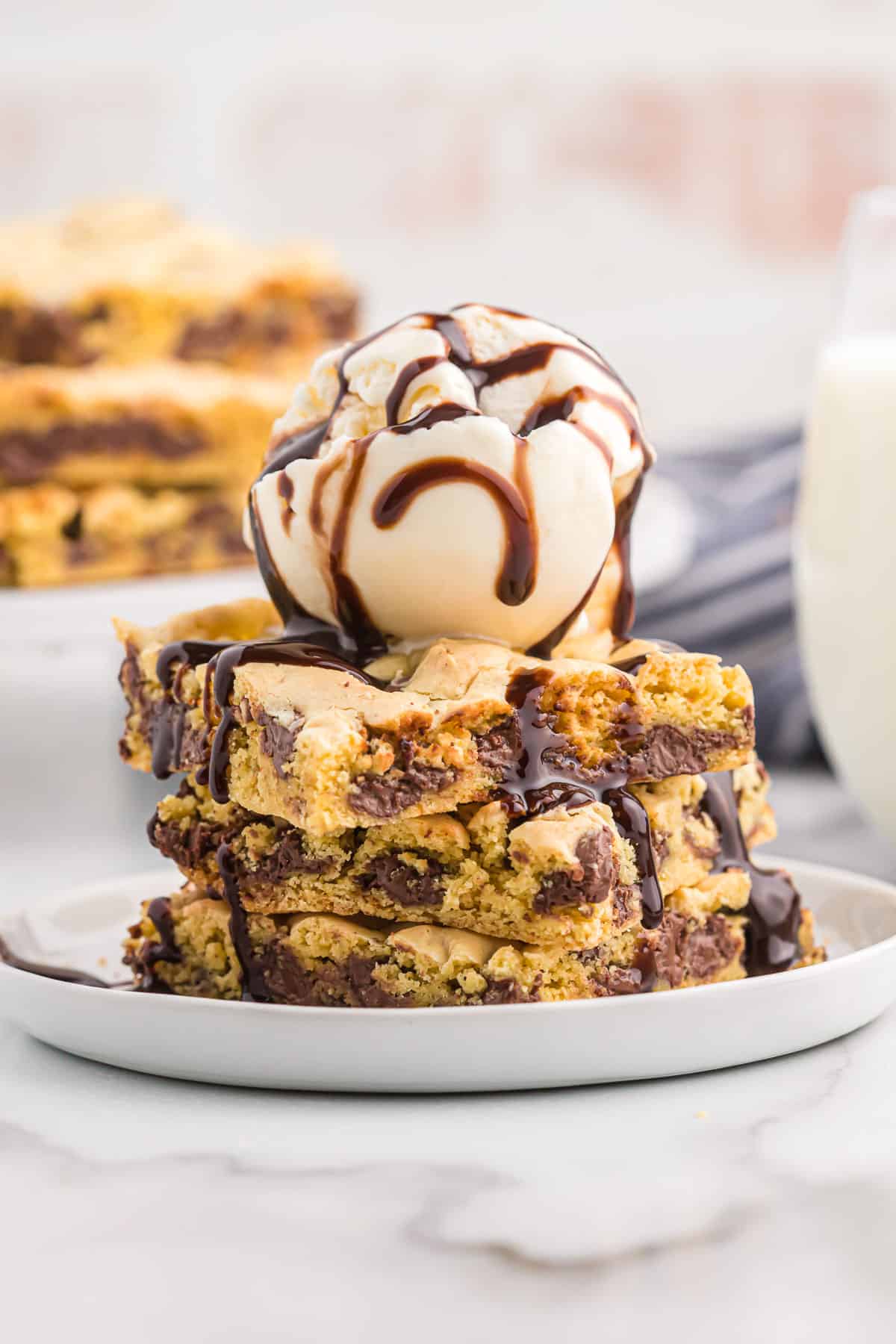 cake mix cookie bars topped with ice cream