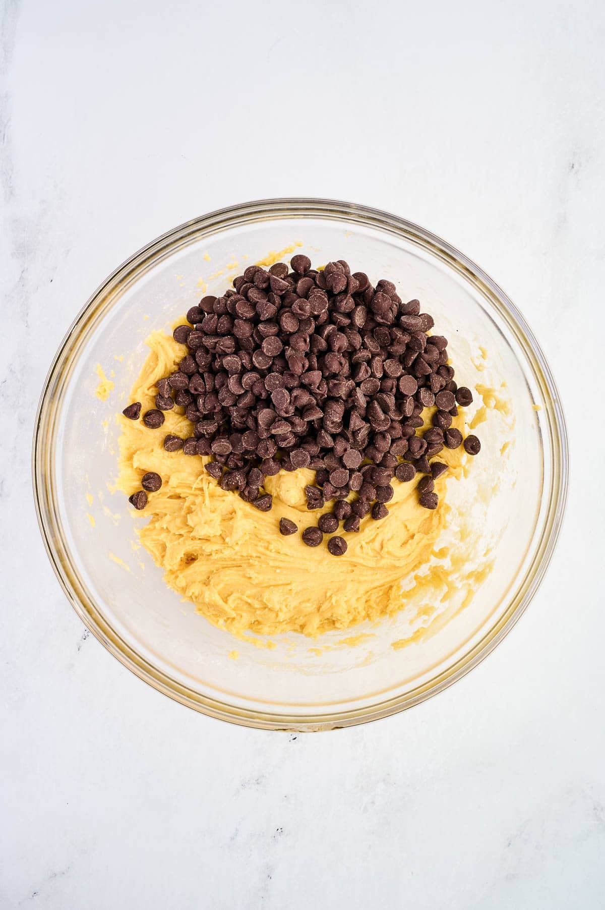 adding the chocolate chips to the batter