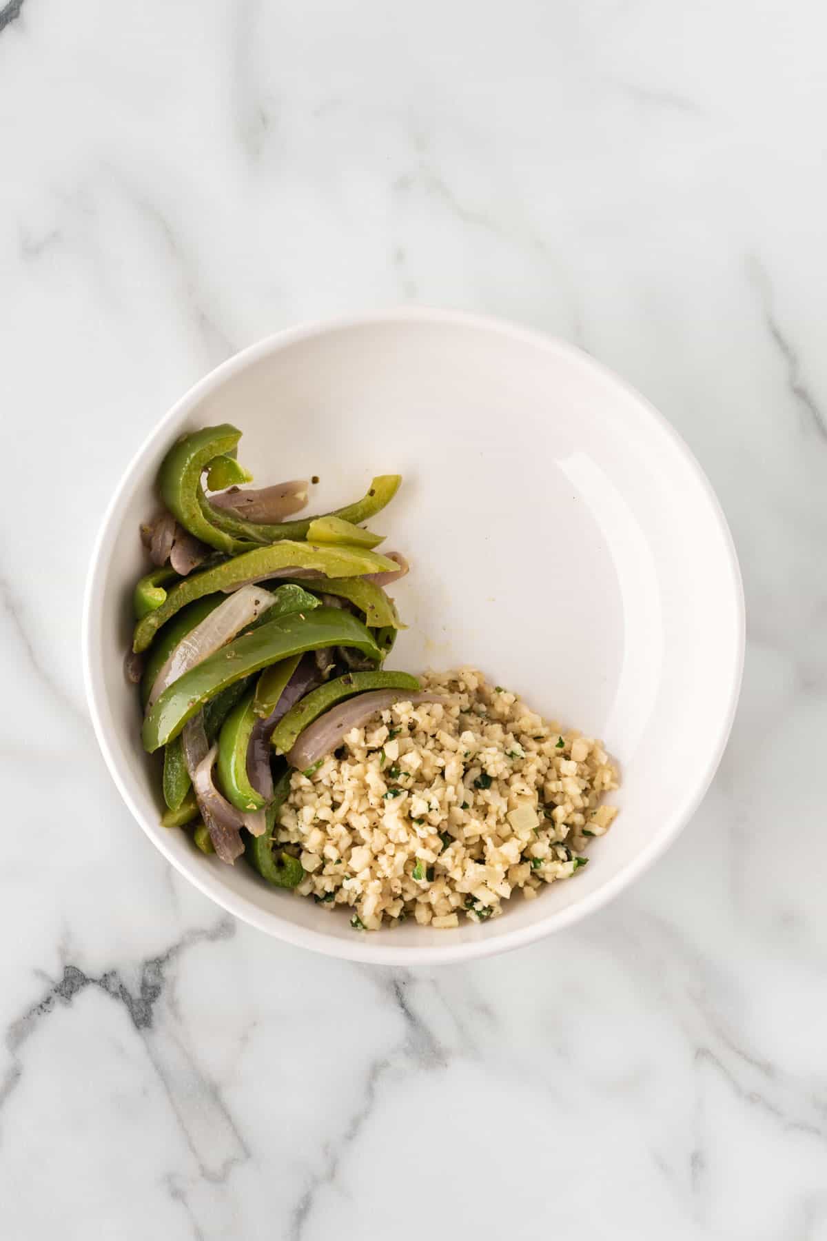 cauliflower rice and fajita veggies in a bowl