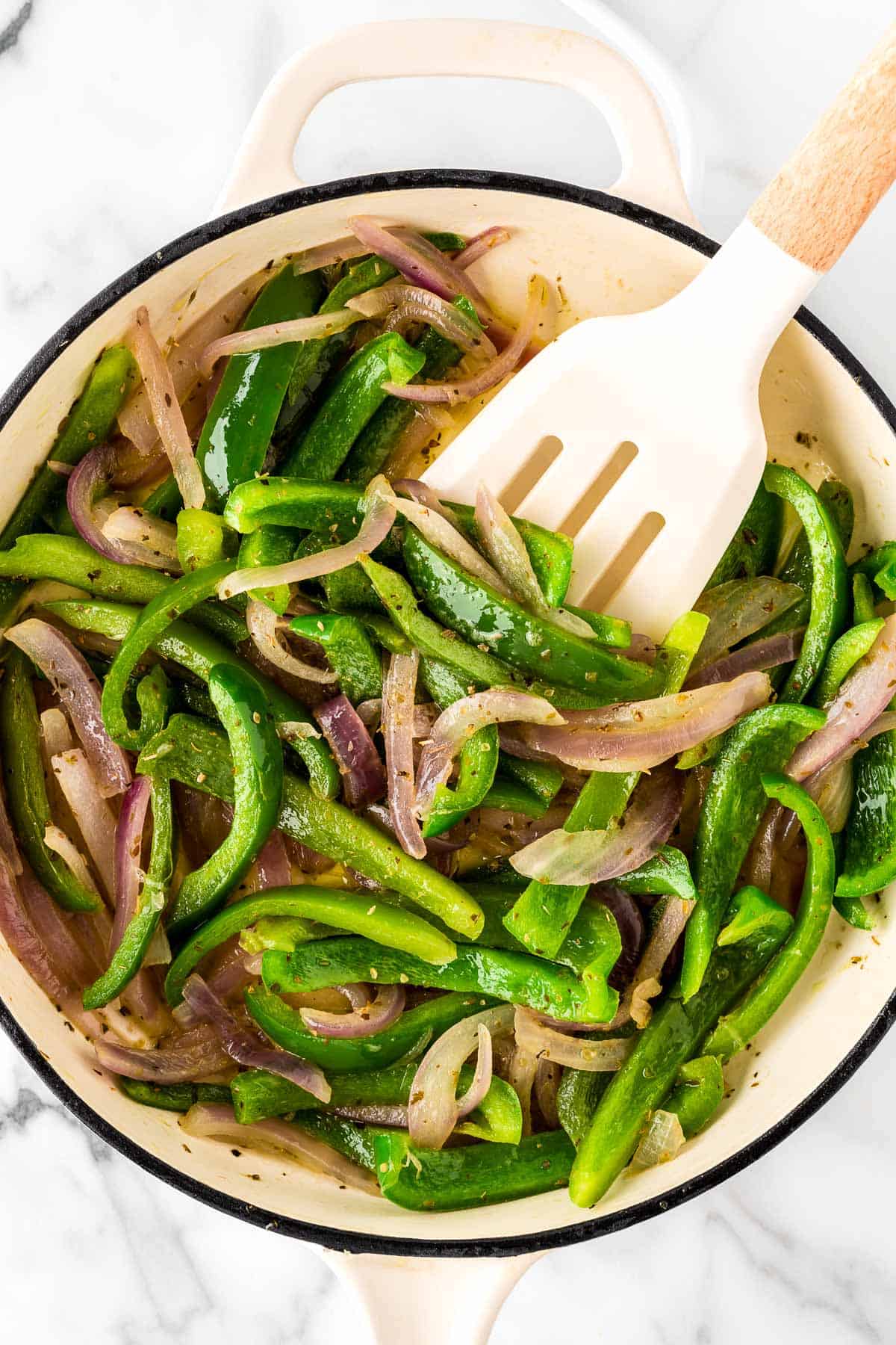 stirring the fajita veggies