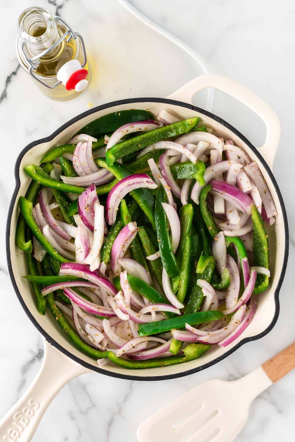 bell pepper and red onion in a skillet