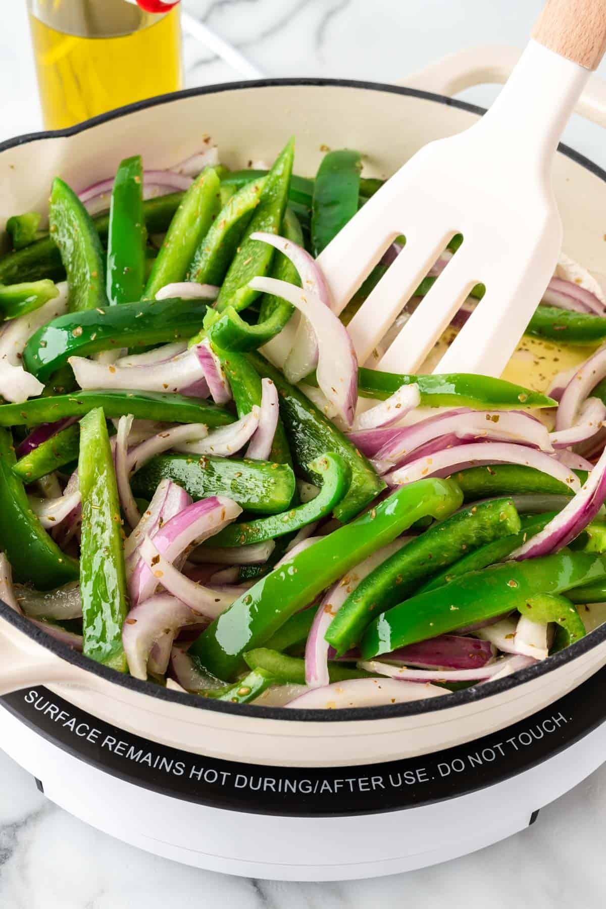 stirring the fajita veggies