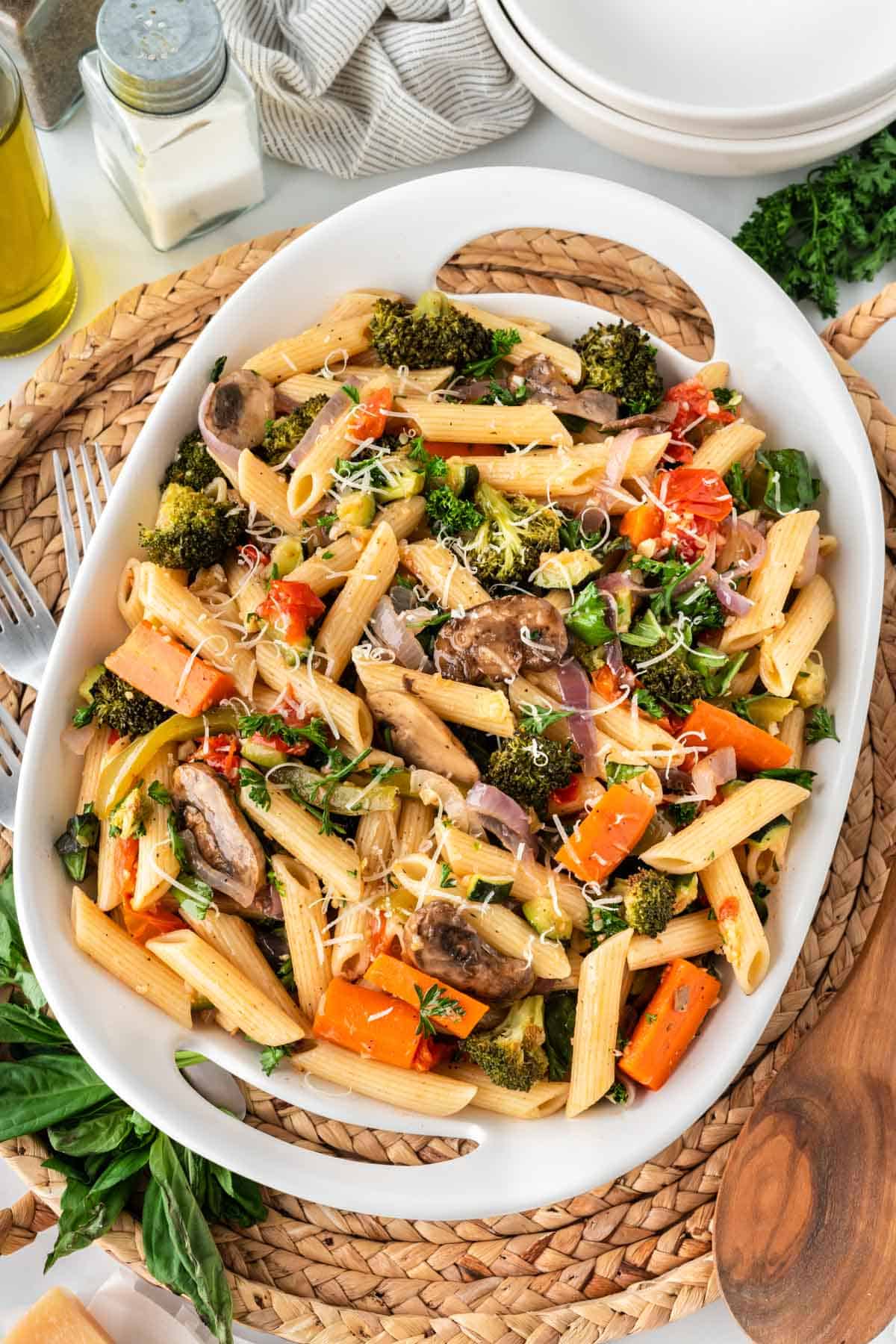 roasted veggie pasta in a white serving dish