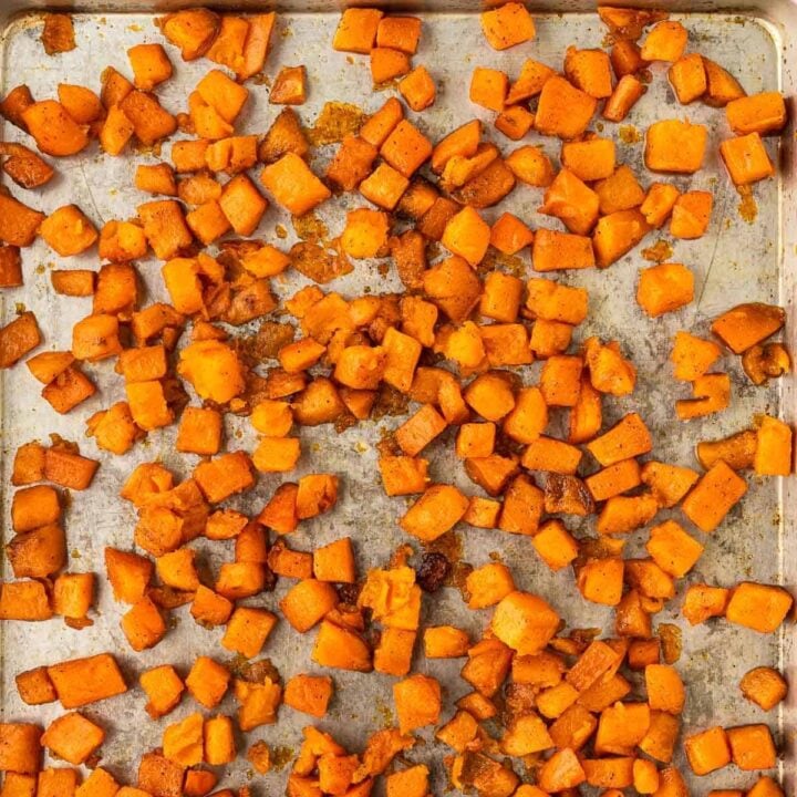 roasted sweet potato cubes on a baking sheet