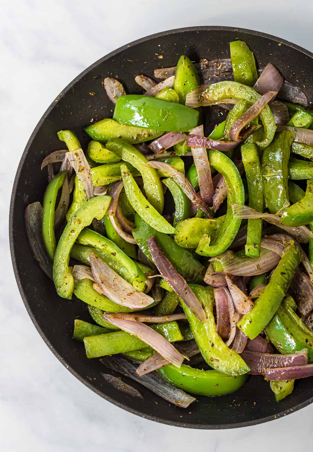 cooked fajita veggies in a skillet