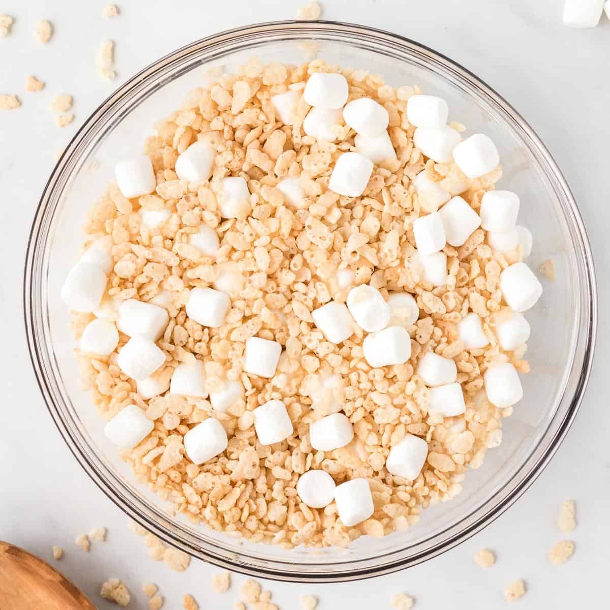 mini marshmallows and rice krispies mixed together in a bowl