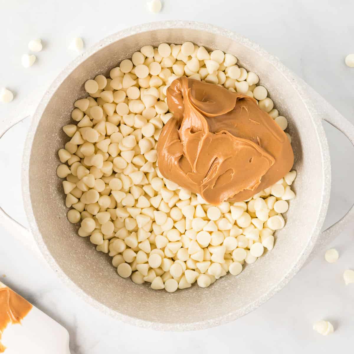 white chocolate chips with peanut butter in a sauce pan
