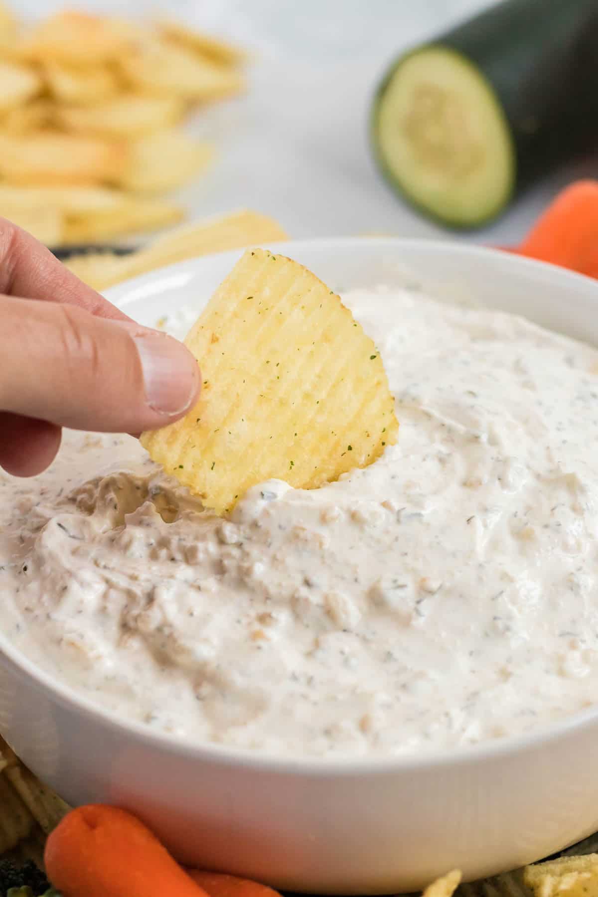 chip being dipped into a chip dip