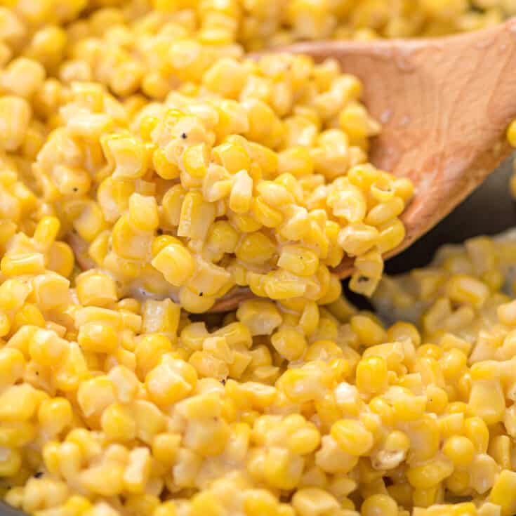 honey butter skillet corn on a wooden spoon