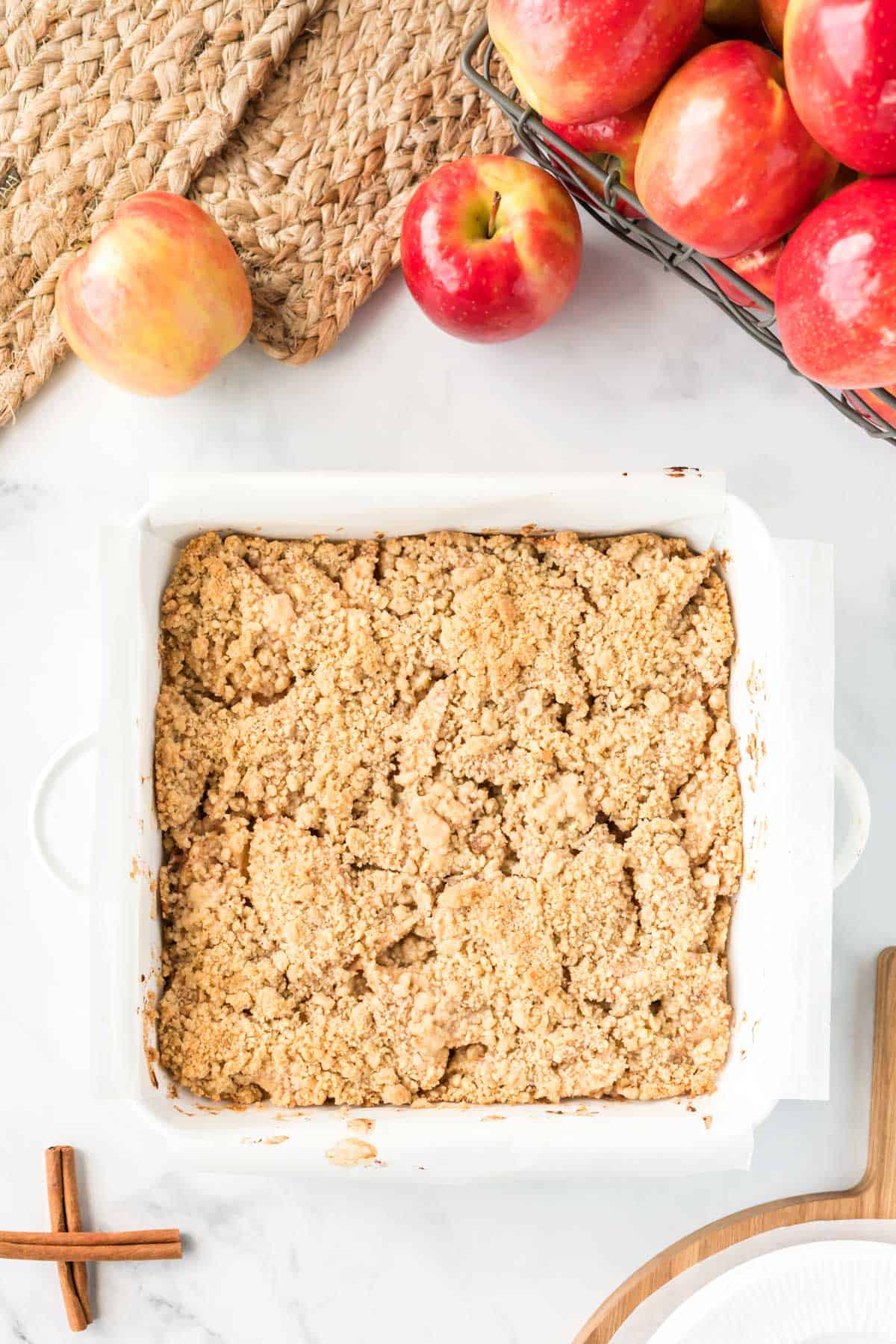 apple crisp bars in a white square baking dish