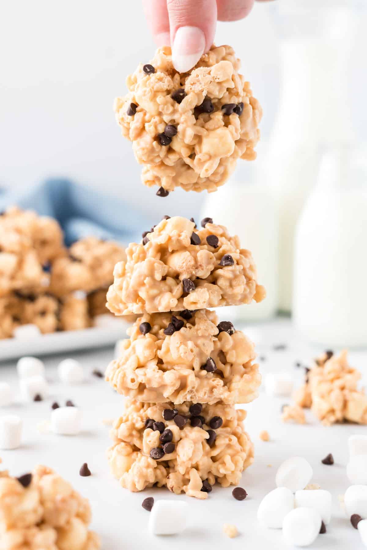 cookies stacked with a hand grabbing one
