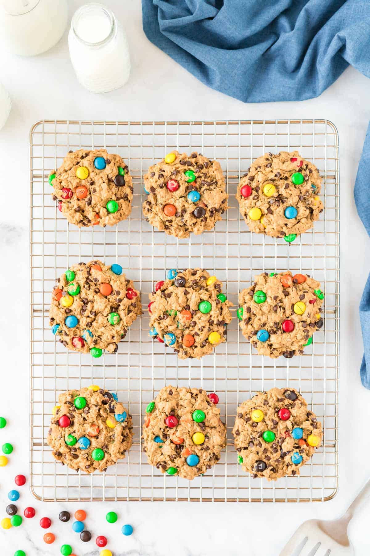 flourless monster cookies on a wire cooling rack