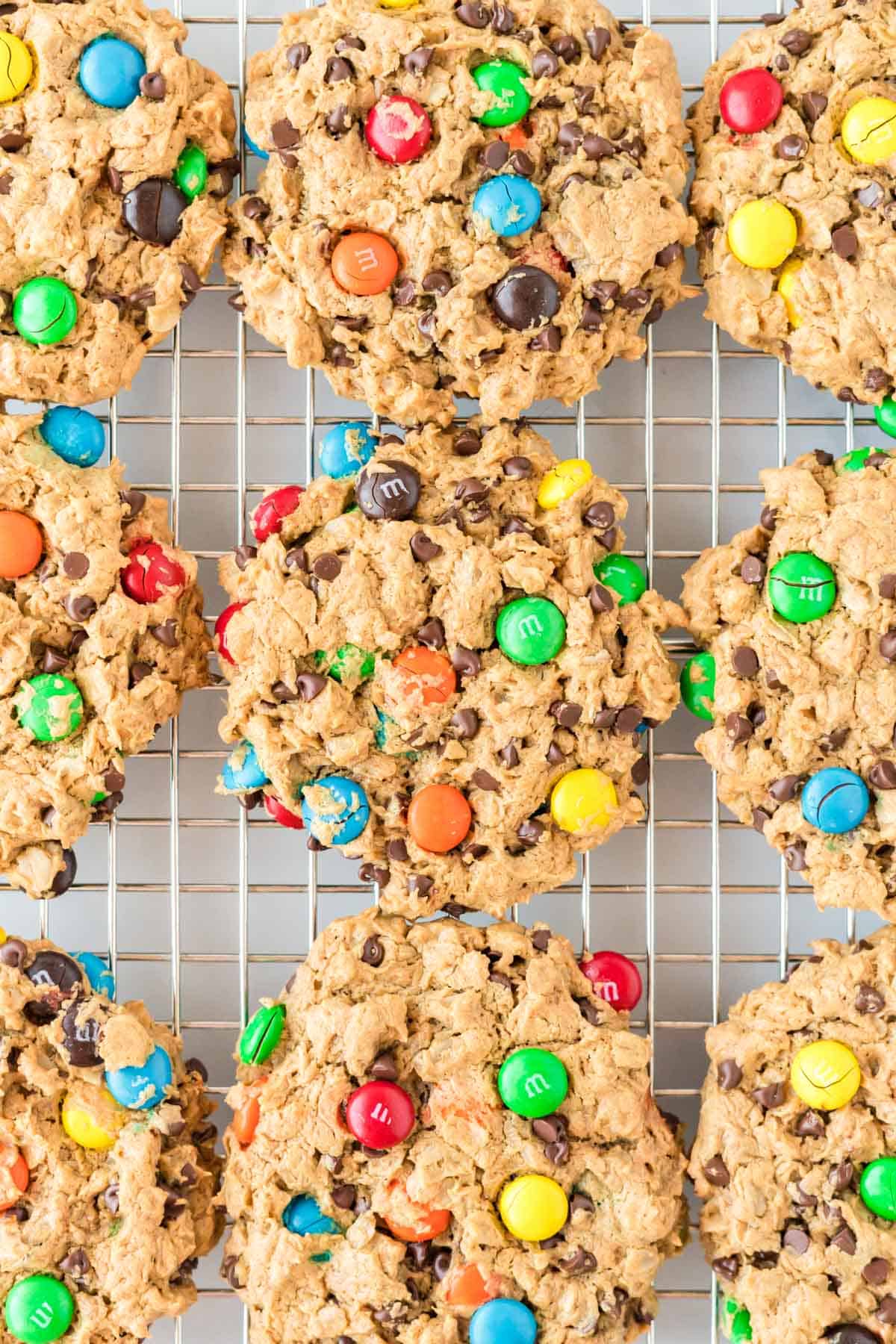 flourless monster cookies on a wire cooling rack