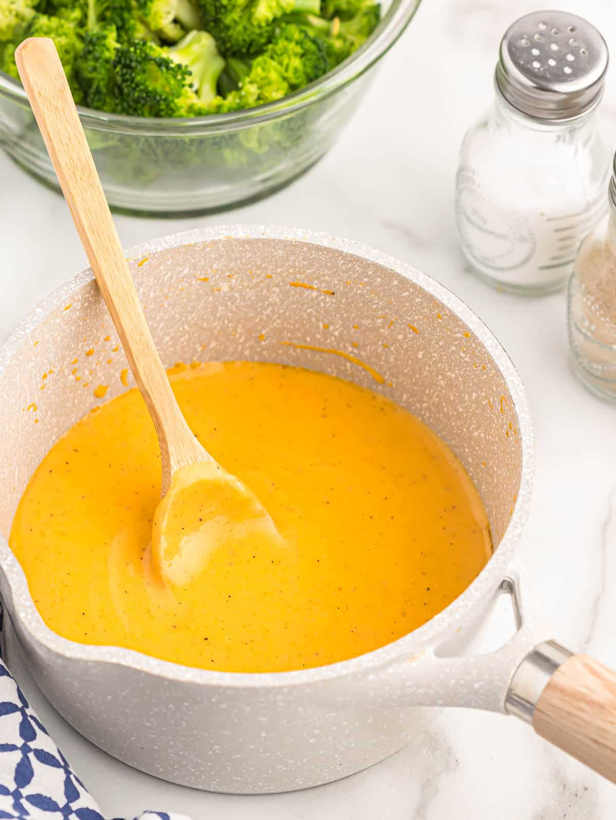 cheddar cheese sauce in a sauce pan