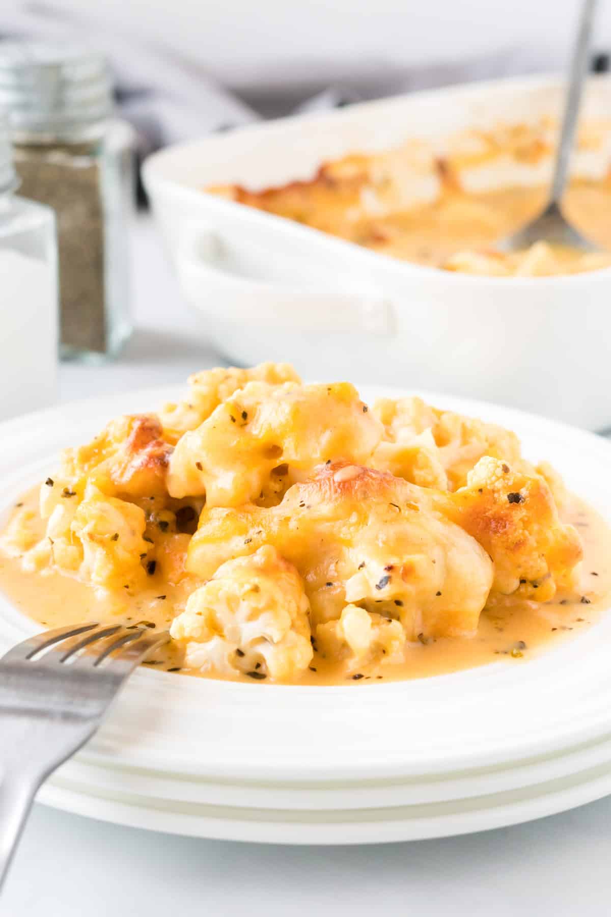 cheesy cauliflower on a white plate