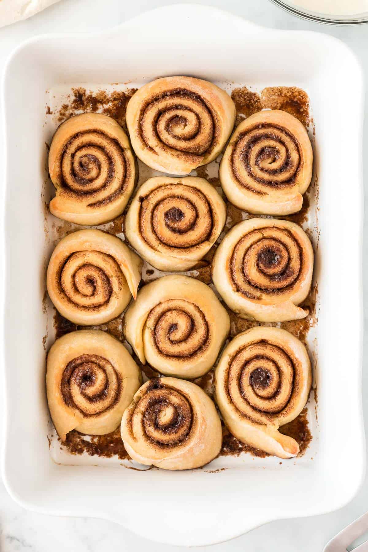 baked cinnamon rolls in the baking dish