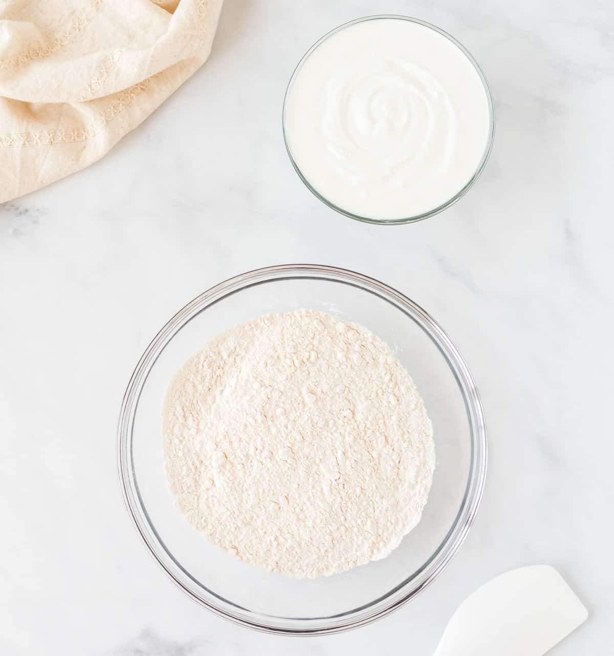 self rising flour and greek yogurt in bowls