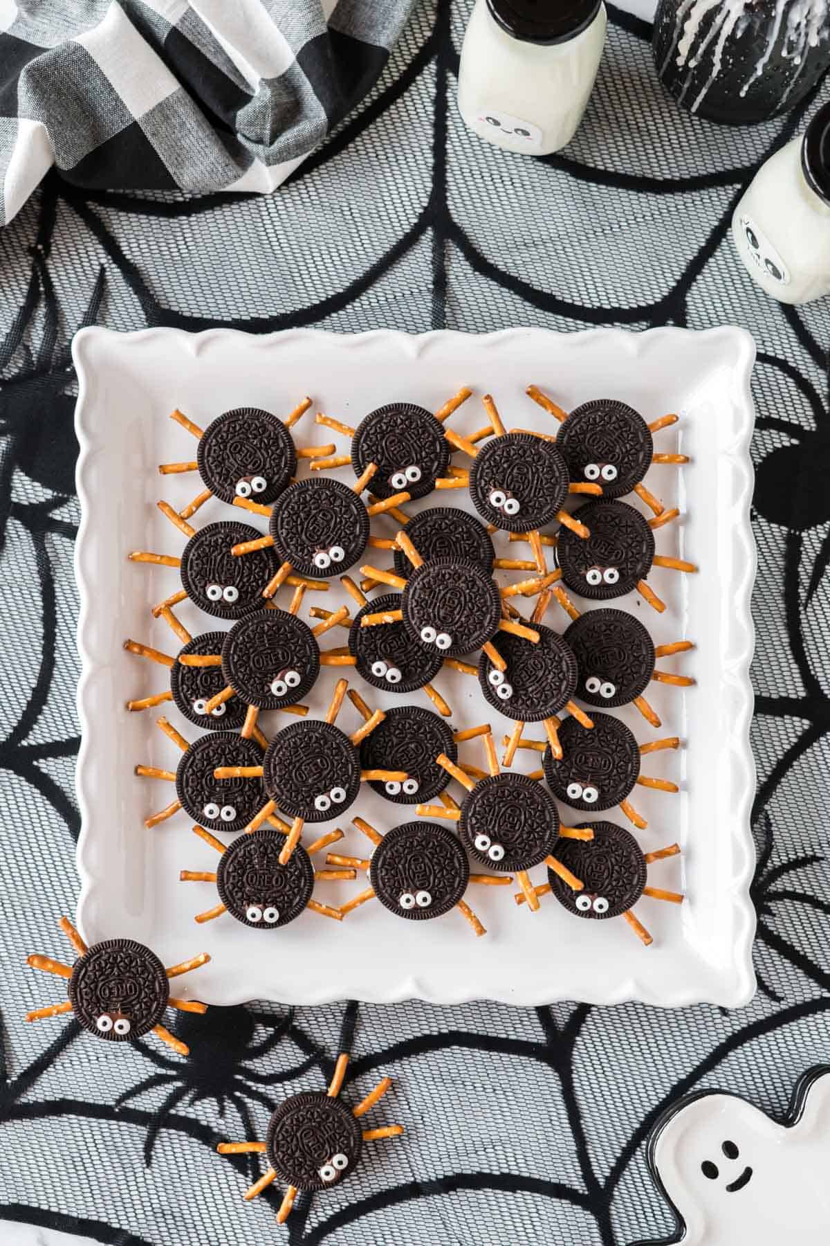 spider cookies on a white tray