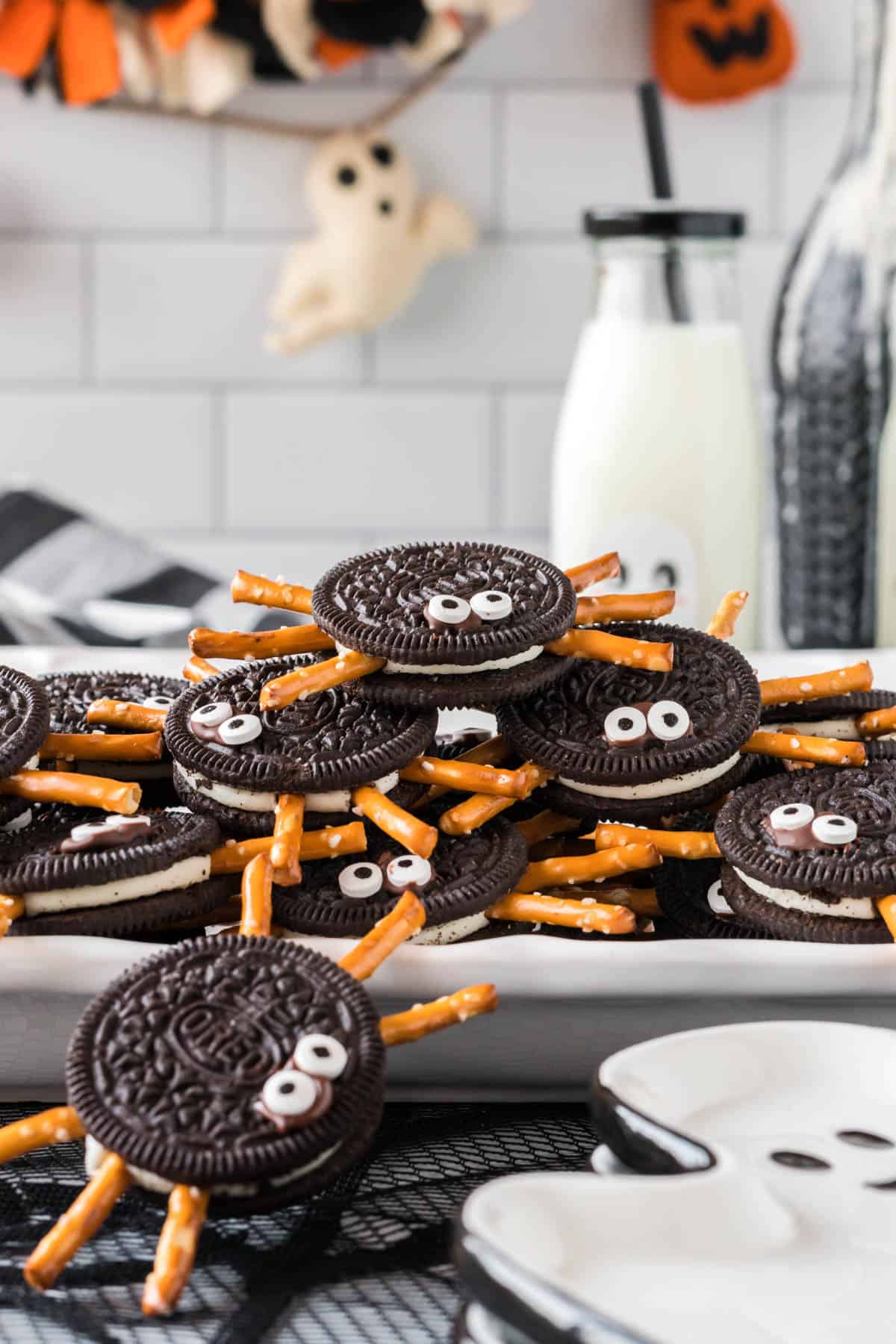 spider cookies on a white tray