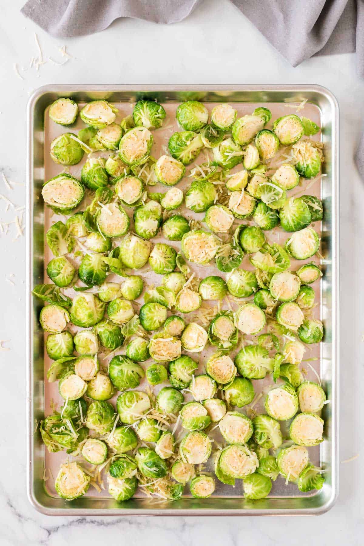 raw brussels sprouts on the baking sheet