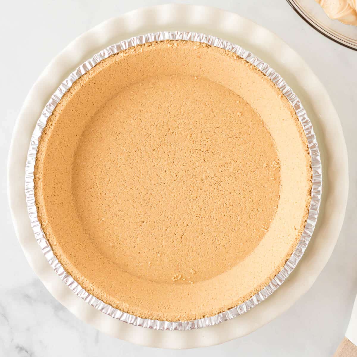 graham cracker crust in a pie dish