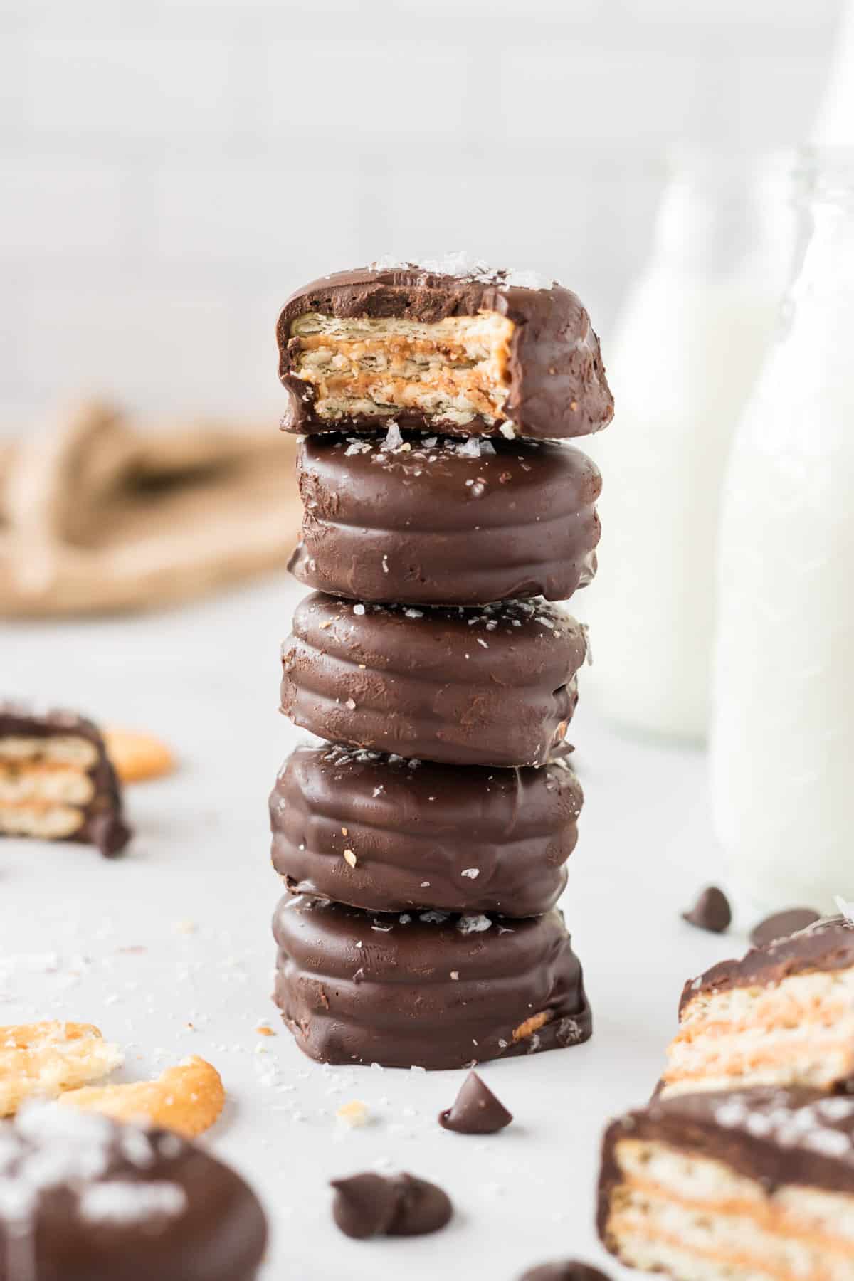 stacked cookies with the top one missing a bite