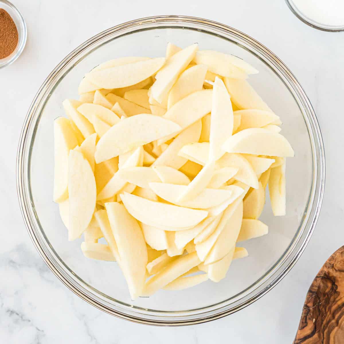 thinly sliced apples in a bowl