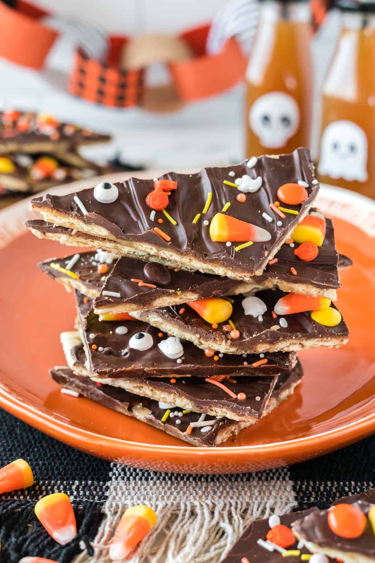 halloween crack candy pieces stacked on an orange plate