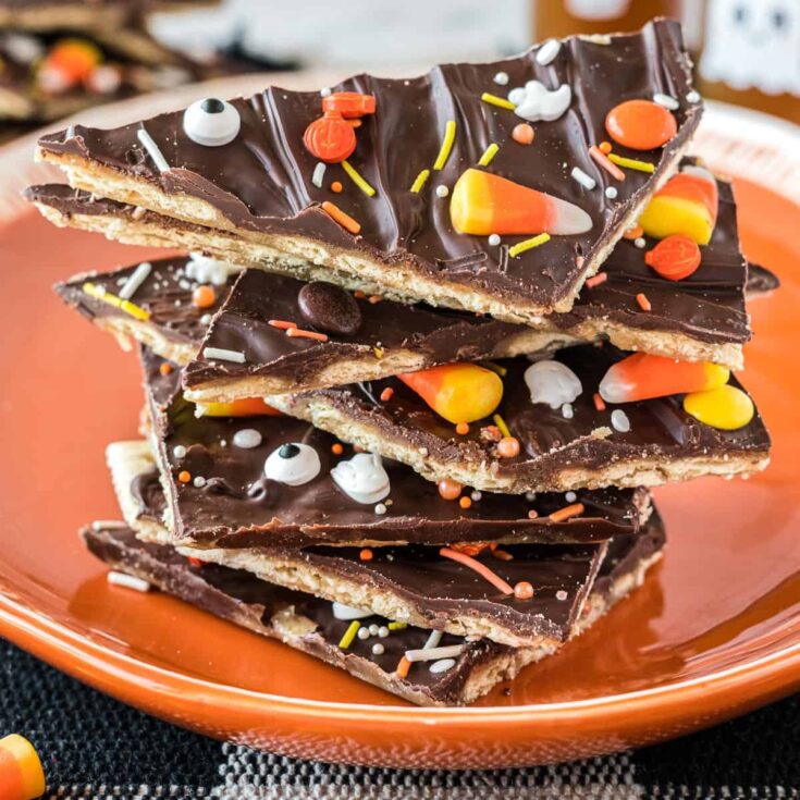 halloween crack candy pieces stacked on an orange plate