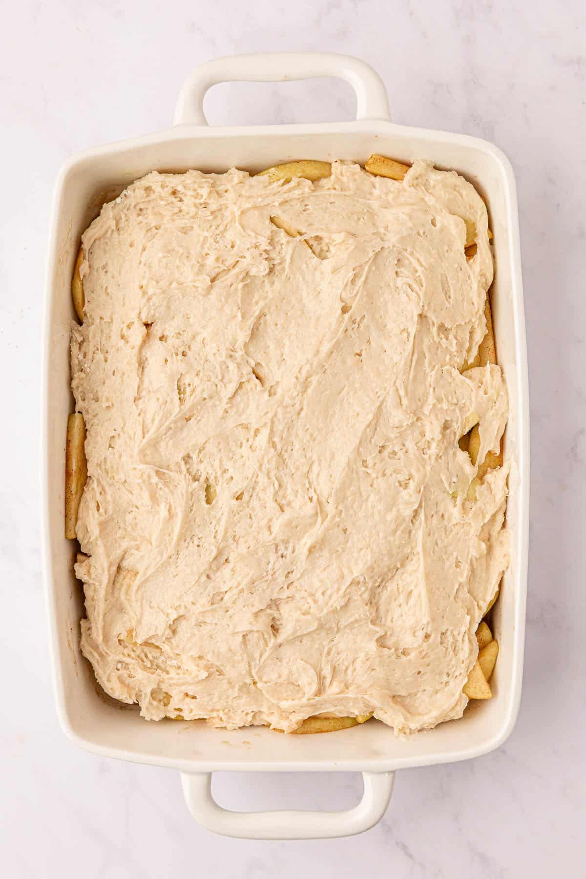 cake mix apple cobbler in a baking dish