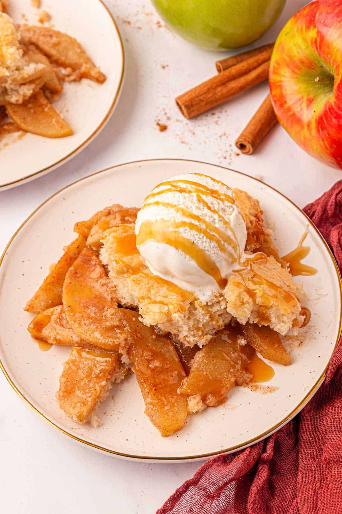 cake mix apple cobbler topped with vanilla ice cream and caramel sauce