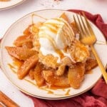 cake mix apple cobbler topped with vanilla ice cream and caramel sauce