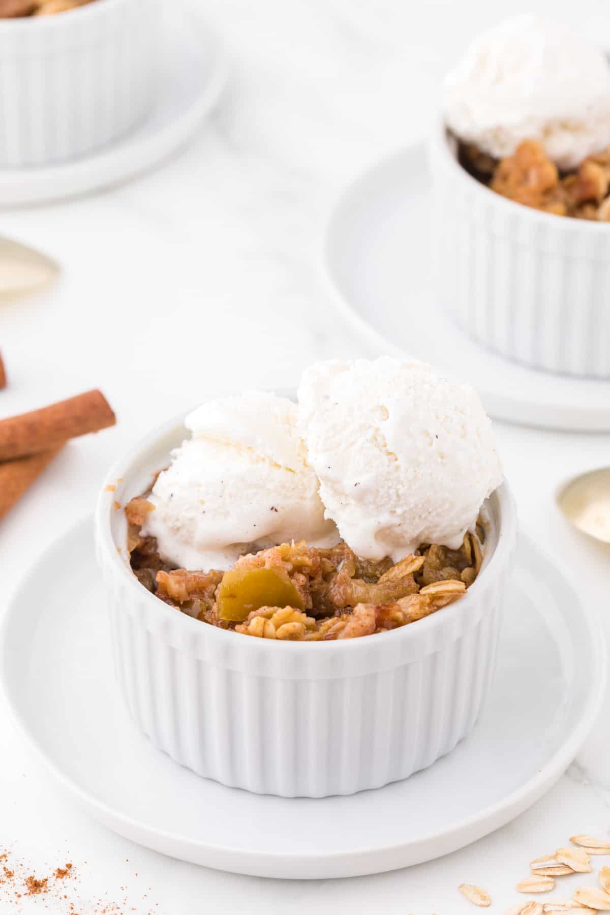 apple crisp serving topped with ice cream