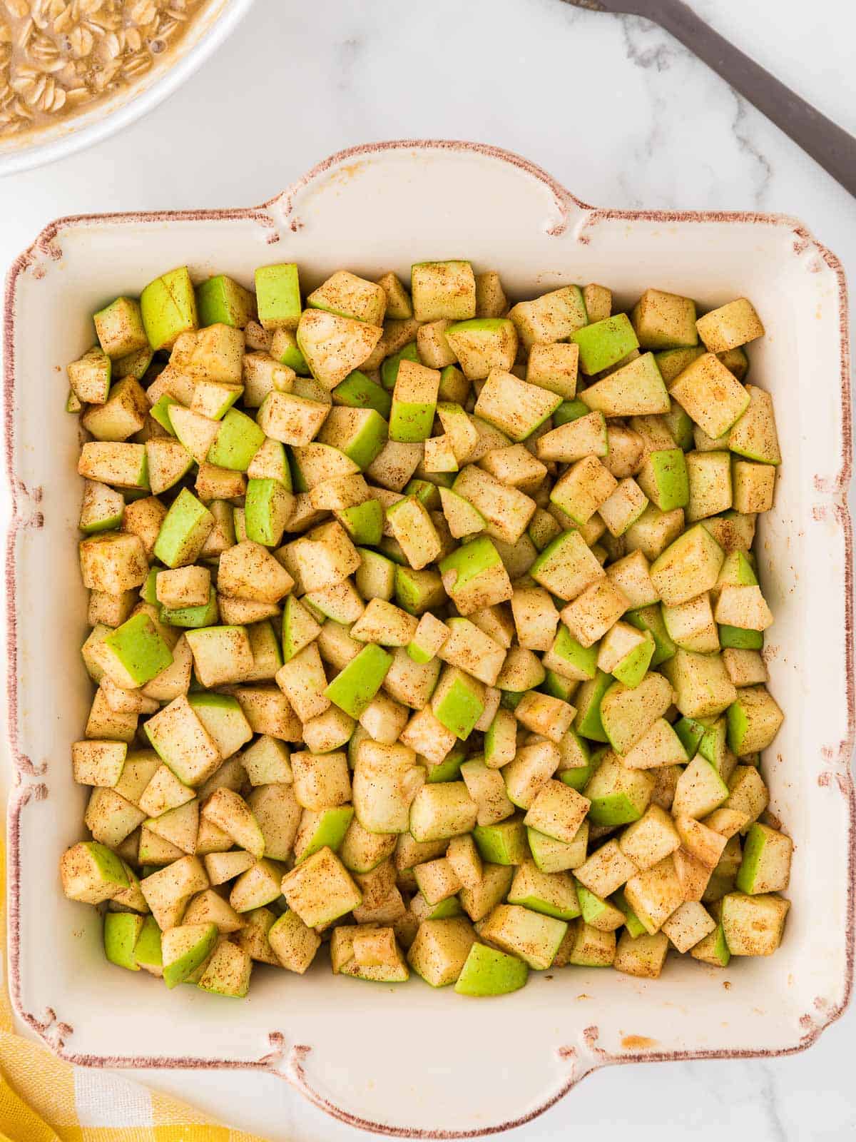 apple crisp filling in a square baking dish