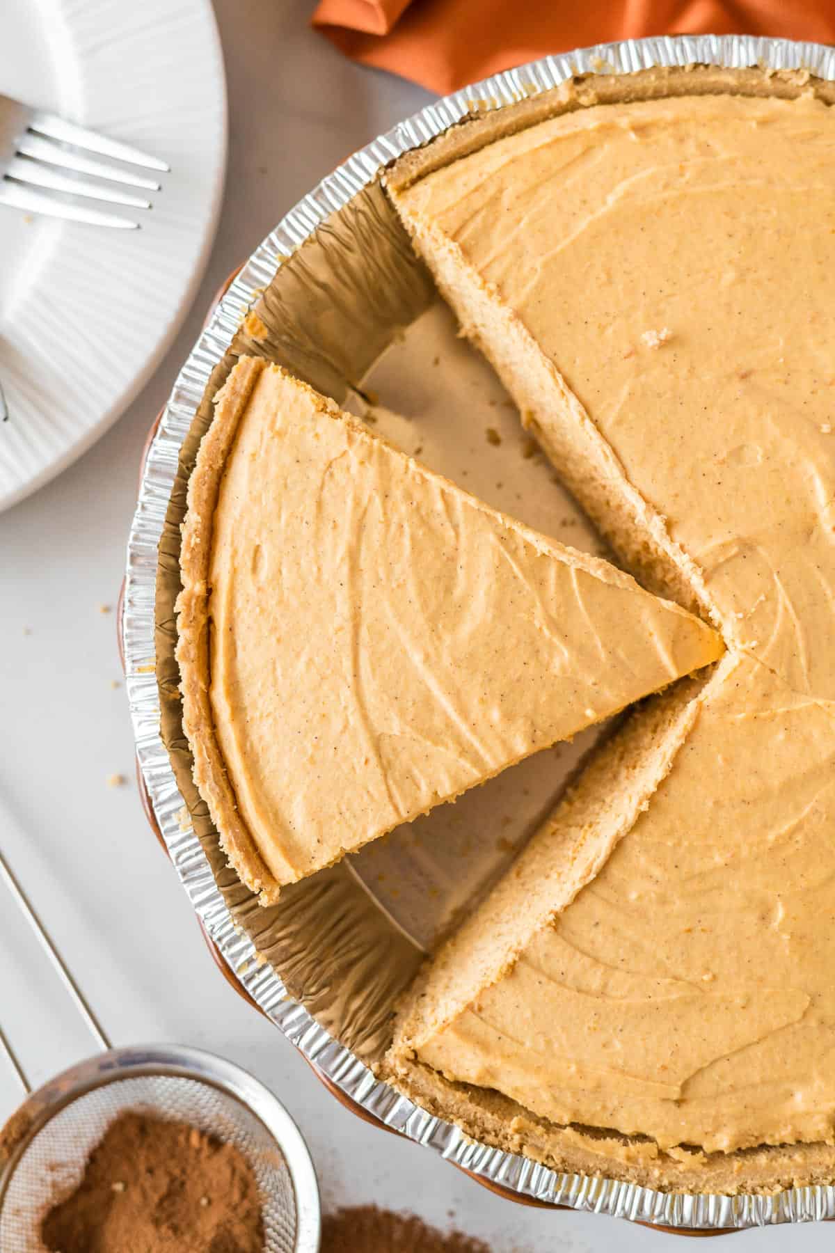 pumpkin cream pie slice cut in the pan