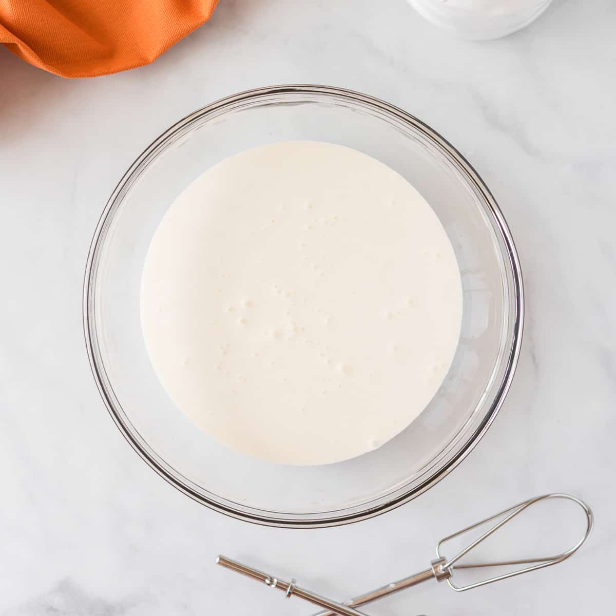 heavy cream in a mixing bowl