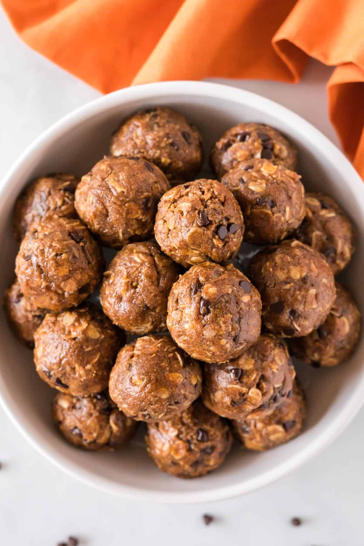 pumpkin energy balls stacked in a bowl