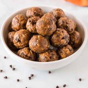 pumpkin energy balls stacked in a bowl