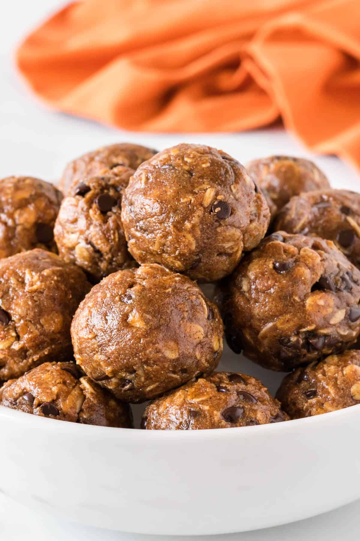 pumpkin energy balls stacked in a bowl