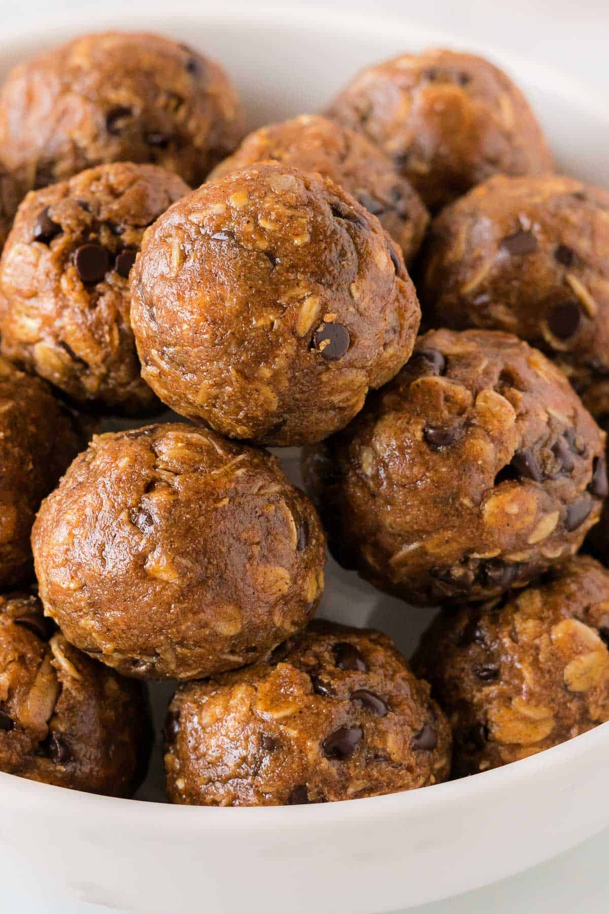 pumpkin energy balls stacked in a bowl