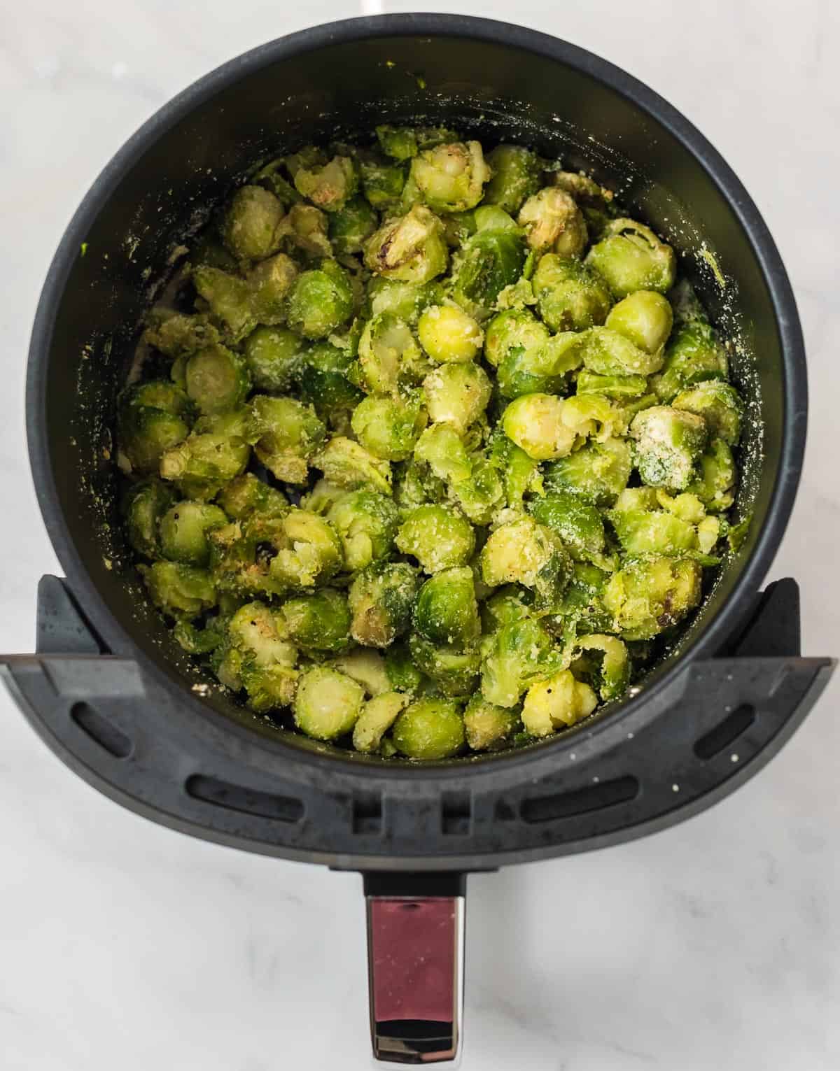 brussel sprouts cut up and topped with parmesan cheese